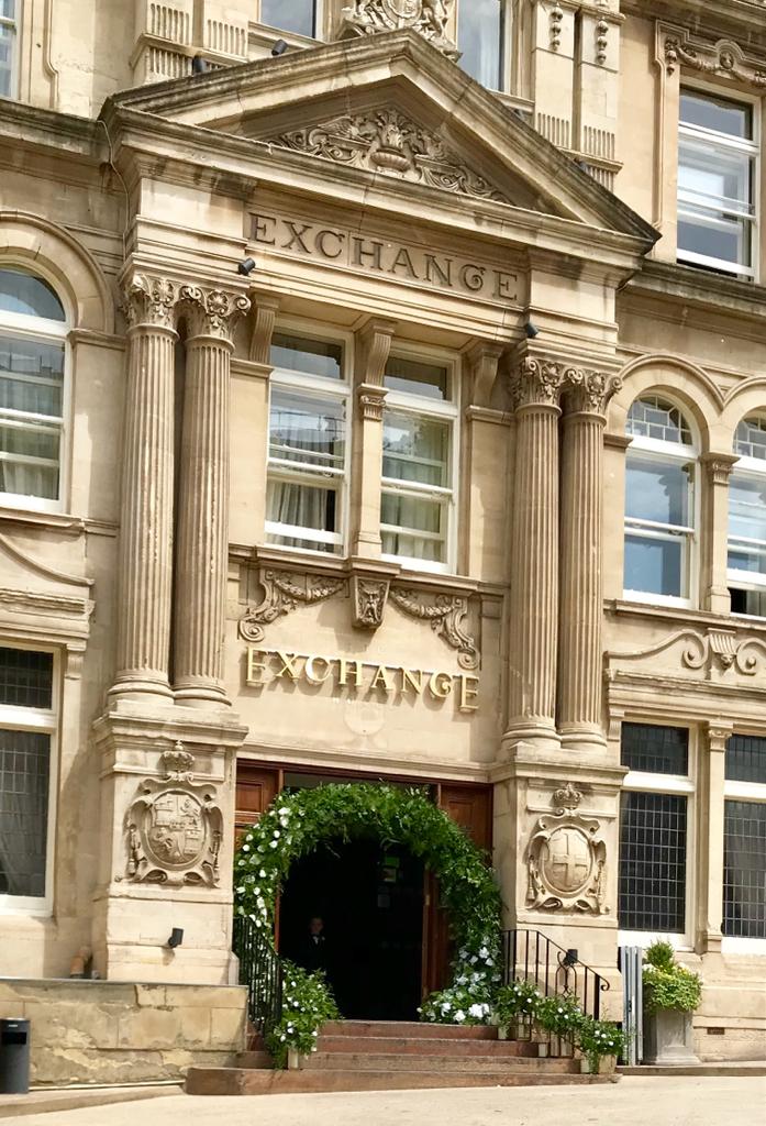 A large stone building with the word exchange on it
