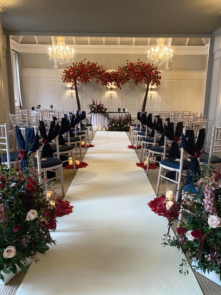 a wedding ceremony is set up in a large room