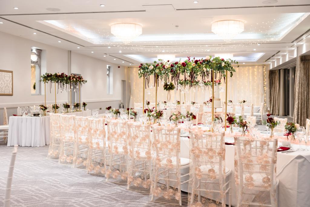 a large room with tables and chairs set up for a wedding